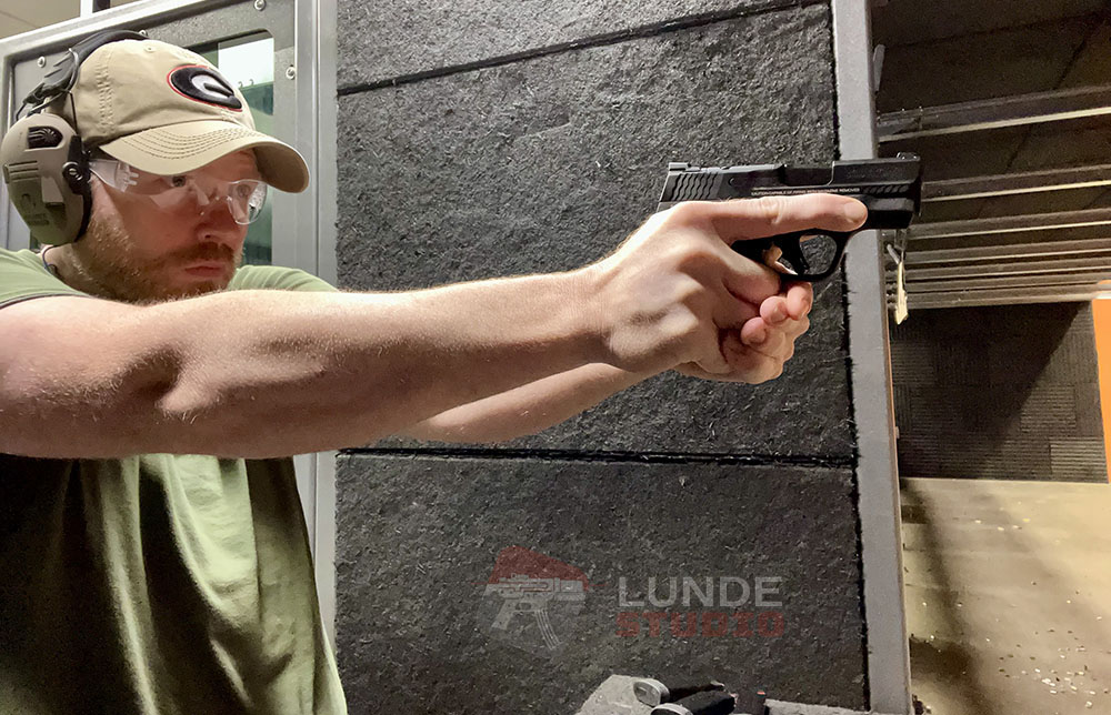 Shooting a pistol at Eagle Gun Range in Lewisville TX
